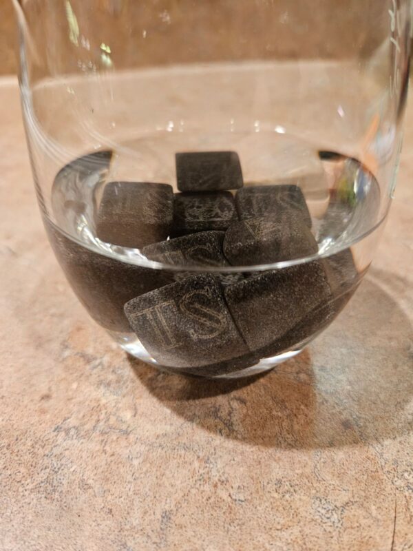 Whiskey stones at the bottom of a glass